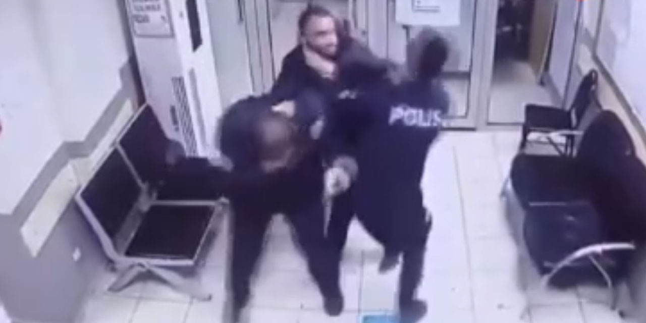 Çeşitli suçlardan aranan şahıs polis merkezinde memurlara saldırarak kaçmaya çalıştı