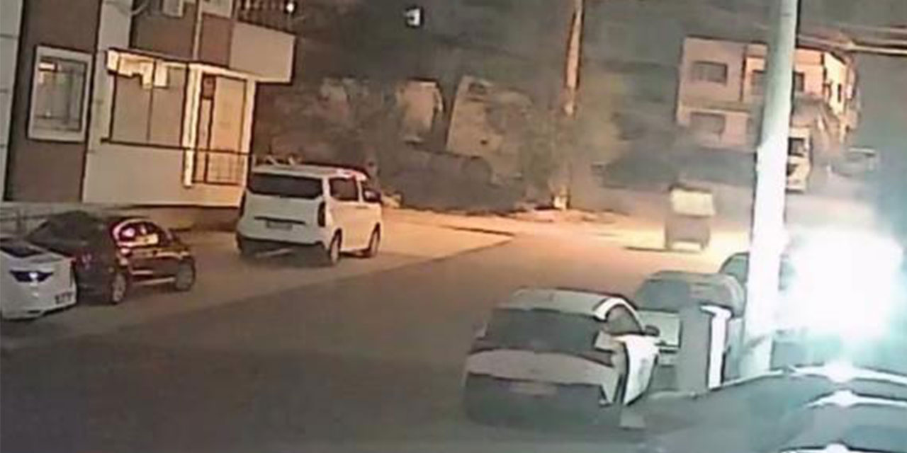 Şiddetli fırtınayla harekete geçen çöp konteyneri, iki otomobilin arasında durdu